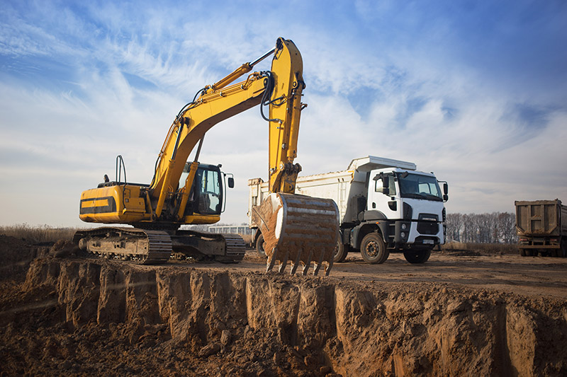 Yellow excavator leased to contractors in California